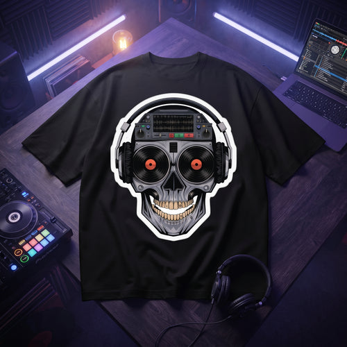 Black oversized t-shirt with cyberpunk DJ skull graphic featuring vinyl record eyes and headphones, flat lay on wooden desk