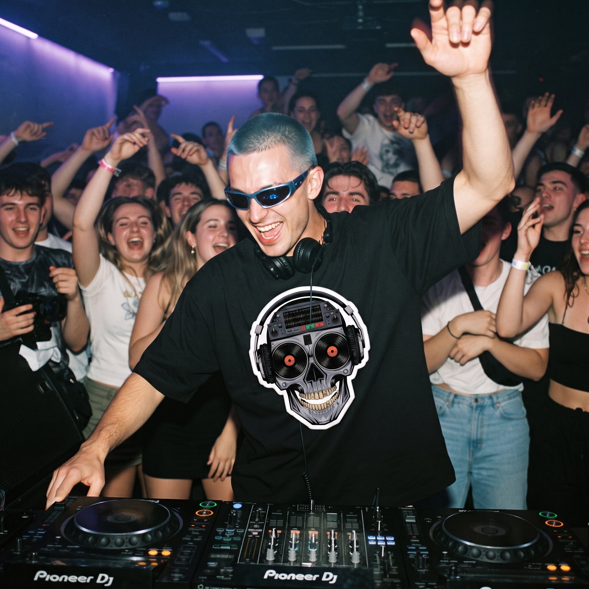 DJ with blue hair and sunglasses wearing cyberpunk skull graphic oversized black t-shirt performing at nightclub