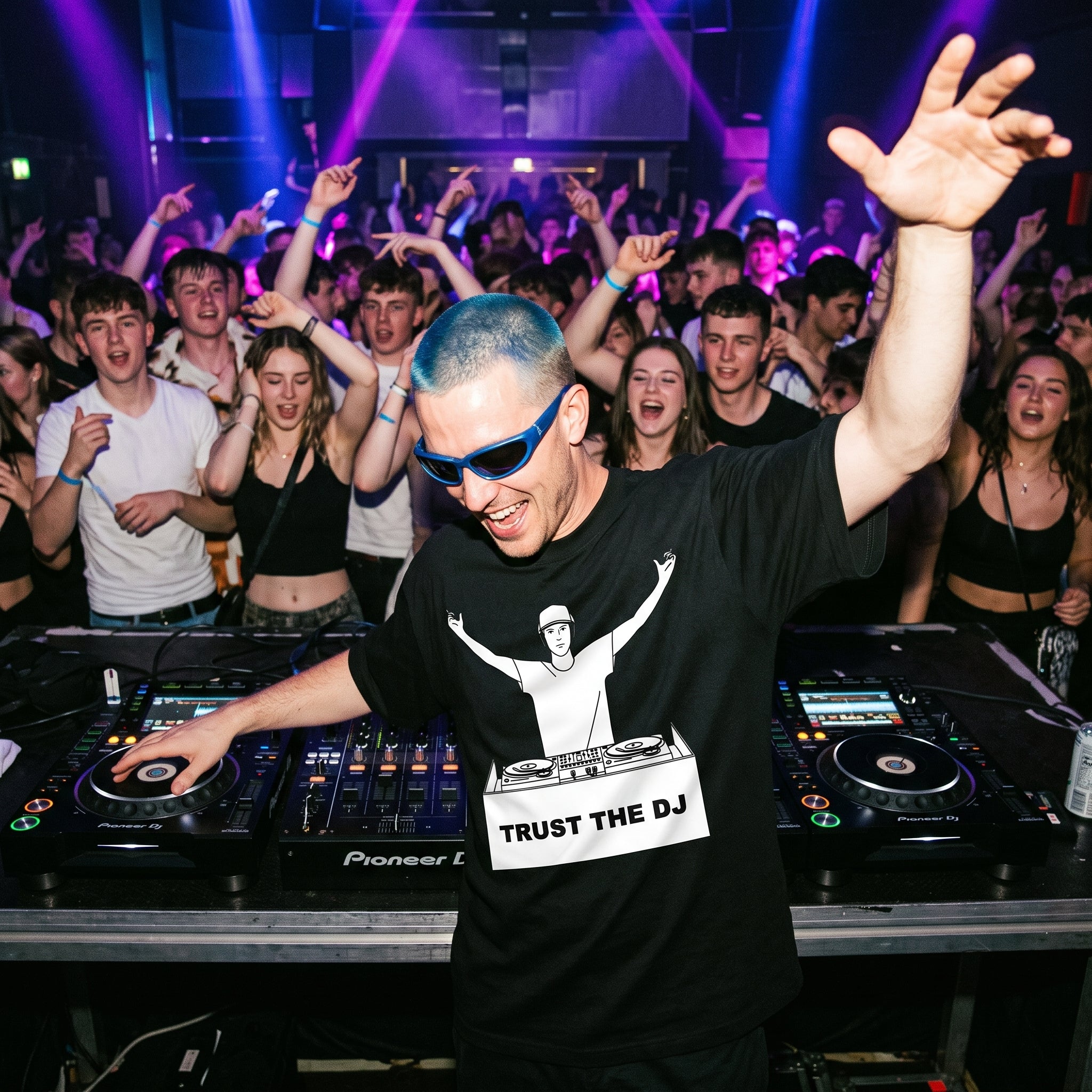 Male DJ in Trust The DJ Quote Black Oversized T-Shirt packed club crowd blue hair