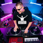 Male DJ wearing Trust The DJ Quote Oversized T-Shirt live studio session top angle