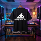 "DJing Is An Art" quote graphic on a premium oversized black tee.