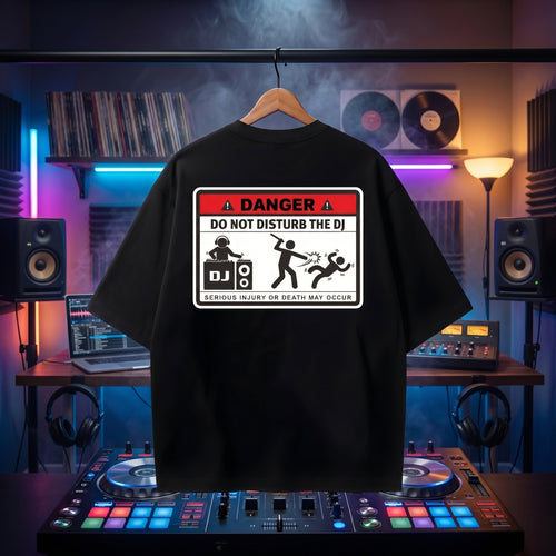 "Danger: DJ In Action" high-energy print on an oversized black rave t-shirt.