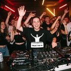 Female DJ in Trust The DJ Quote Black Oversized T-Shirt performing in club crowd