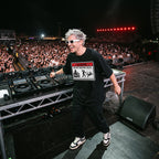 Male DJ in Danger DJ Do Not Disturb Black Oversized T-Shirt festival stage massive crowd