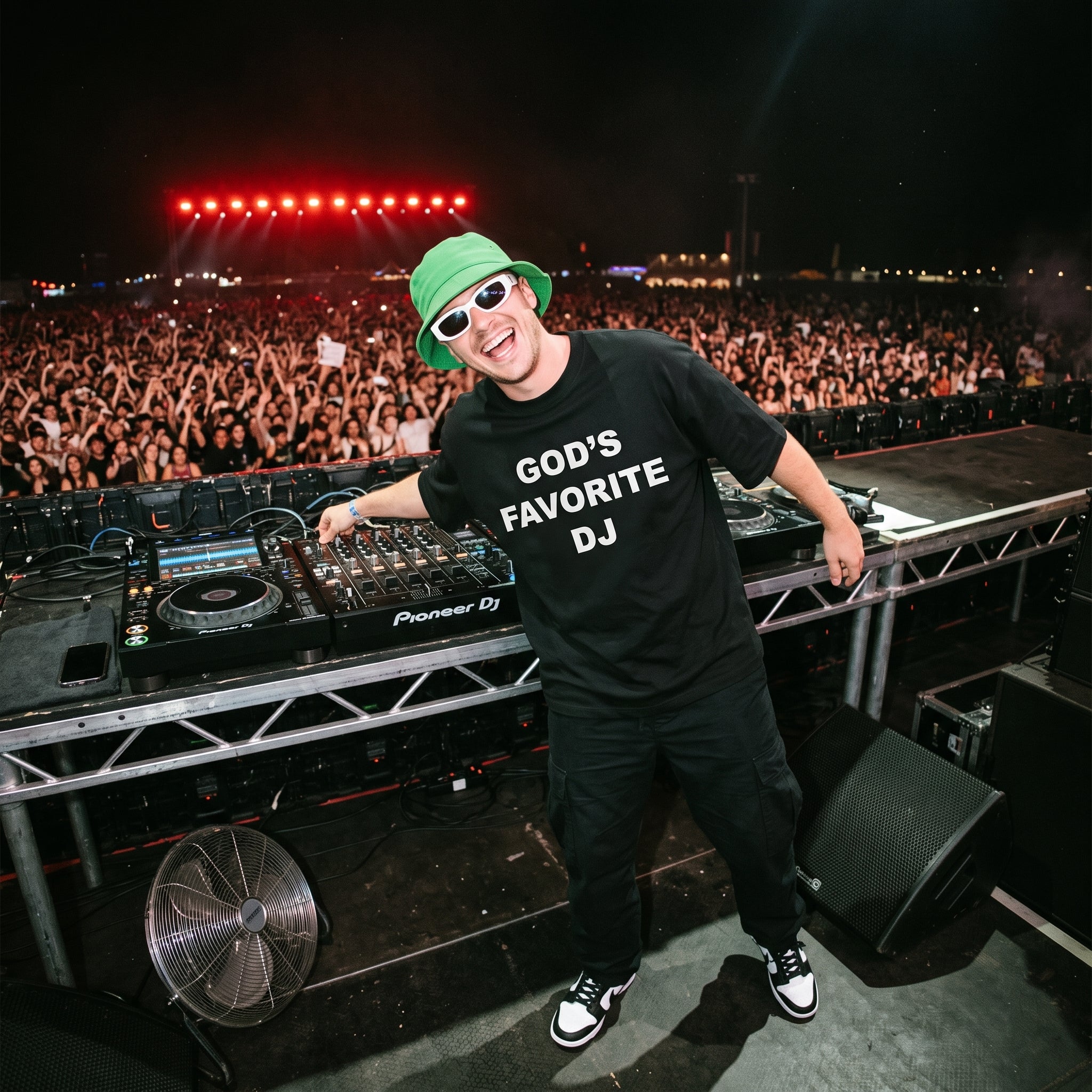 Male DJ in God's Favorite DJ Quote Black Oversized T-Shirt on festival stage massive crowd