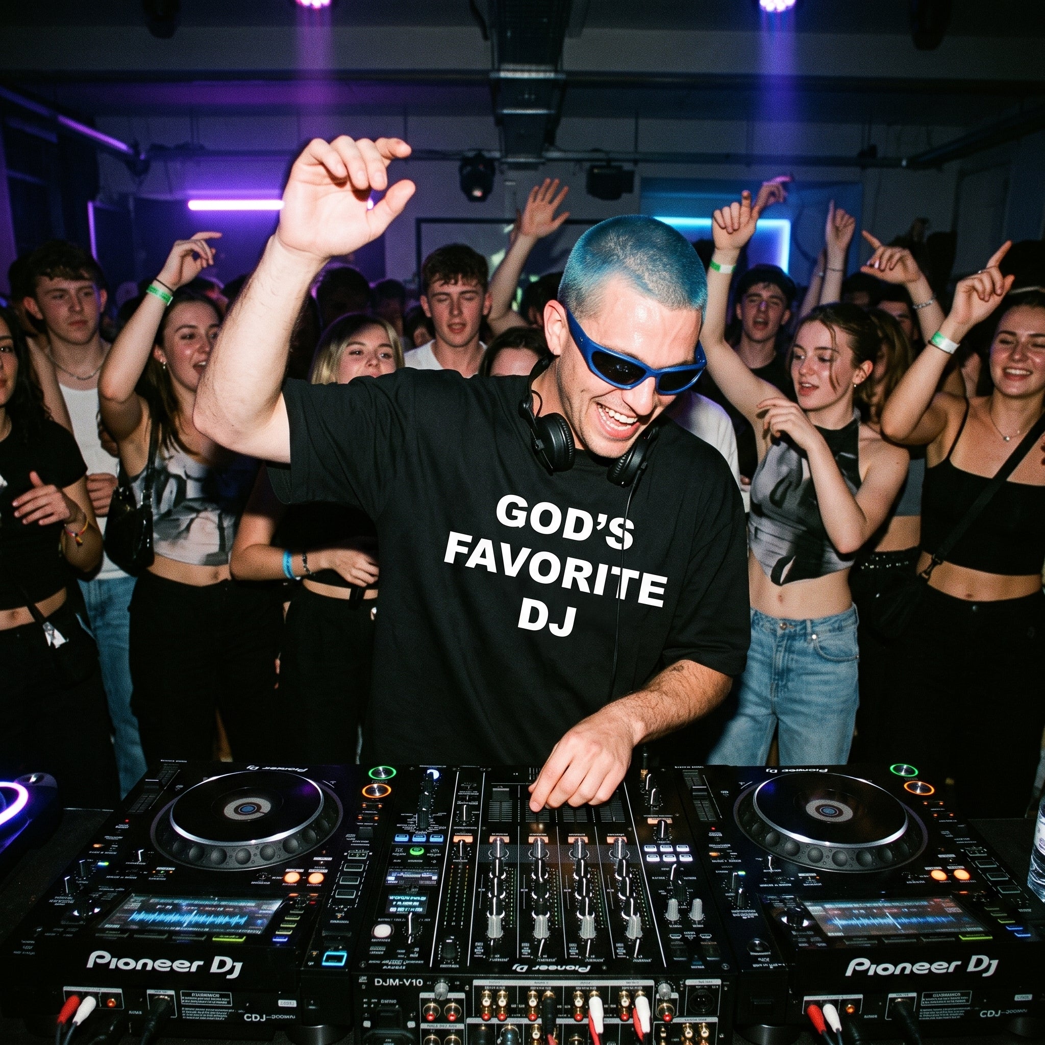 Male DJ in God's Favorite DJ Quote Black Oversized T-Shirt packed club blue hair sunglasses