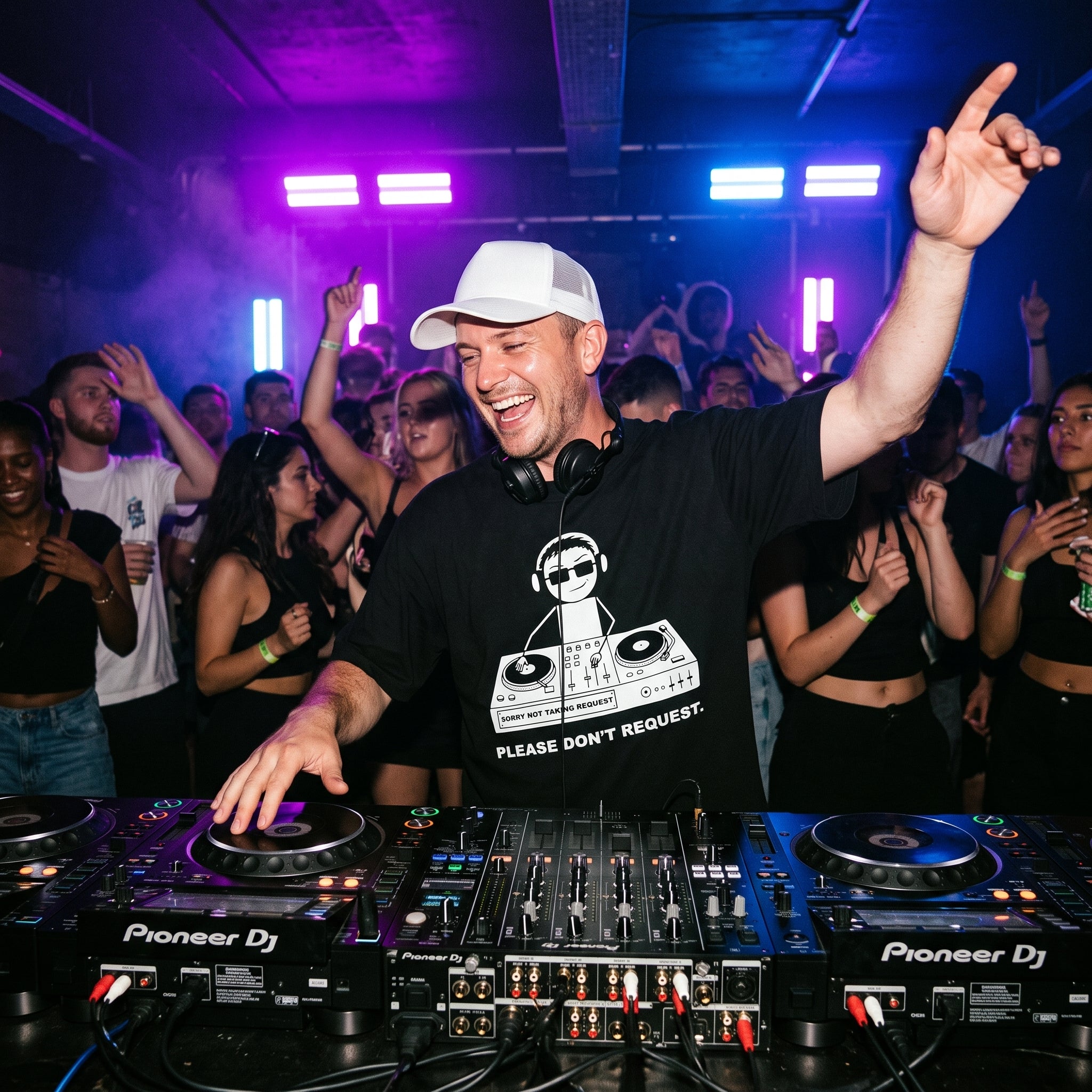 DJ wearing Sorry Not Taking Request oversized t-shirt performing on Pioneer decks in front of cheering club crowd