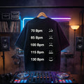 Minimalist BPM chart graphic printed on an oversized black DJ t-shirt.