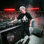DJ in DJ Turntable Graphic Black Oversized T-Shirt on festival stage massive crowd