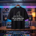 "I'm A Crazy DJ" bold quote print on a pitch-black oversized festival tee.