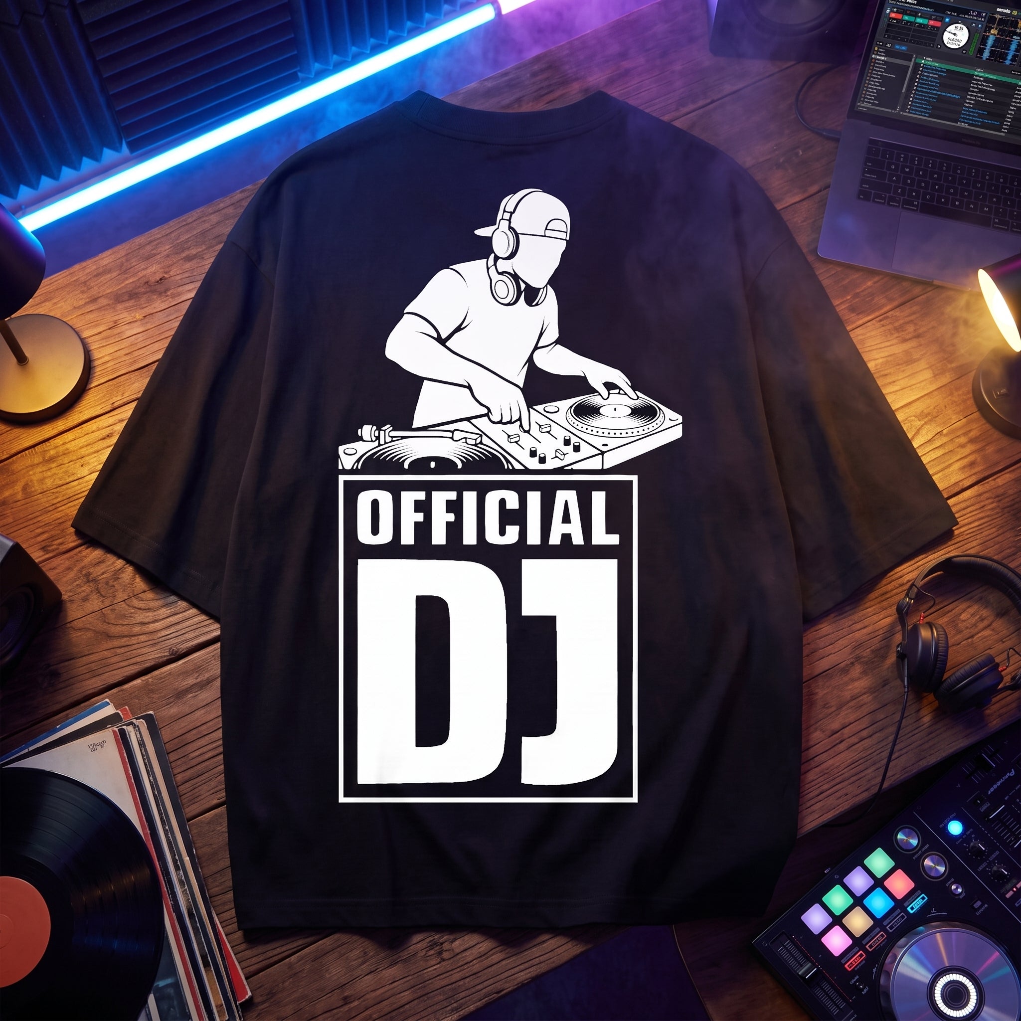 Black Official DJ Oversized T-Shirt flat-lay with vinyl turntable graphic print, displayed with vinyl records and DJ gear
